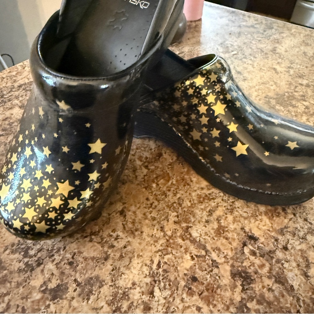 Black and Gold Star Pattern Clogs Dansko